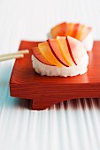 Sweet nigiri sushi with delicate slices of fruit