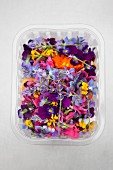 Various edible flowers in a plastic punnet (see above)