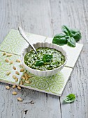 Pesto in a White Bowl; Spilling Over the Side; Spoon