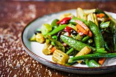 Fried vegetables with baby corn cobs