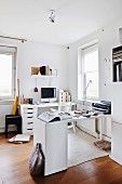 Two modern, white desks in corner