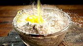 Flour and eggs in a glass bowl