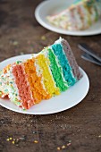 A slice of a rainbow layer cake