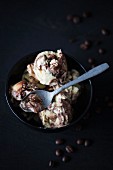 Tiramisu ice cream in a bowl with a spoon