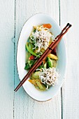 Glass noodle balls with vegetables and chopsticks