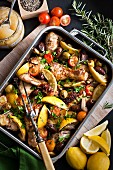 Lemon chicken with herbs, olives and tomatoes