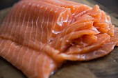 A side of salmon with slices cut into it