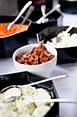 Dried tomatoes and marinated vegetables on a buffet