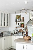 Counter in fitted kitchen with white cabinets