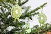 Hand-crafted, rosette Christmas tree decorations with moose motifs & ruffled ribbon
