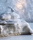 White fluffy and organza cushions covers used as unusual gift packages