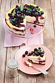 Blackberry and blueberry cheesecake, sliced