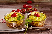 White cabbage and potato bakes with cherry tomatoes