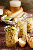 White cabbage with apples as a side dish with sausage and beer