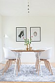 Clear lines in dining room: modern shell chairs around dining table