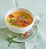Cold carrot and almond soup with croutons and parsley