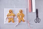 Bread men with pipes and stripped ribbon for Christmas
