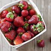 Organic strawberries from Massachusetts in a wooden basket