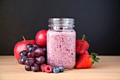 A berry smoothie with grapes and apples