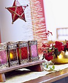 Festive arrangement of miniature lanterns and glass-star lantern