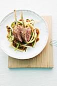 Lamb chops on macaroni with vegetables sauce