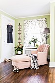 Pink chaise chair in corner