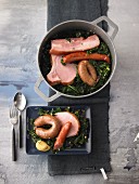 Kale with sausage, bacon and smoked pork chops
