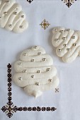 Christmas meringues decorated with silver pearls