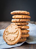 Healthy cardamom biscuits stamped with the word 'Sweet'