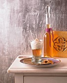 Baked apple liqueur in a glass and a bottle