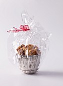 Peanut and chocolate cookies wrapped in cellophane as a gift