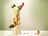 A stack of vegetable animals with an Easter egg