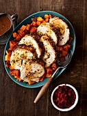 Stuffed turkey roulade with a vegetable medley