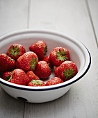 Fresh strawberries in an enamel bowl