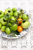 Green vine tomatoes on a plate