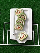 Salmon rolls with spinach and cream cheese for a football themed party