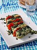 Oven-baked feta cheese with tomatoes and herbs
