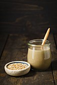 A jar of tahini (sesame seed paste)