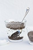 Chia seeds being softened in salt water