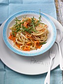 Tagliatelle with carrots, ginger, pine nuts and rocket