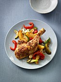 Chicken leg with potatoes, onions and courgette