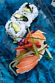 Nigiri sushi with salmon and maki with avocado