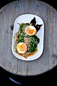 Thai aubergines with spinach, Thai herbs, coconut crunch and soft-boiled egg