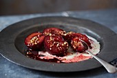 Baked plums with chopped hazelnuts