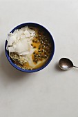 Organic coconut milk yoghurt with dried coconut, passion fruit and hemp seeds