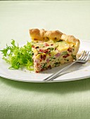 A slice of ham, rocket and goat's cheese quiche