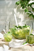 Melon punch with cucumber on a table outside