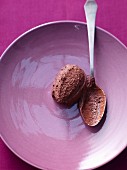 Mousse au chocolat with a spoon on a plate