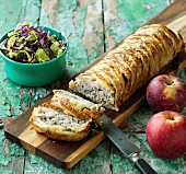 Puff pastry strudel with pork, onions and apples