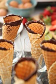 Homemade ice cream cones with chocolate edges in glasses